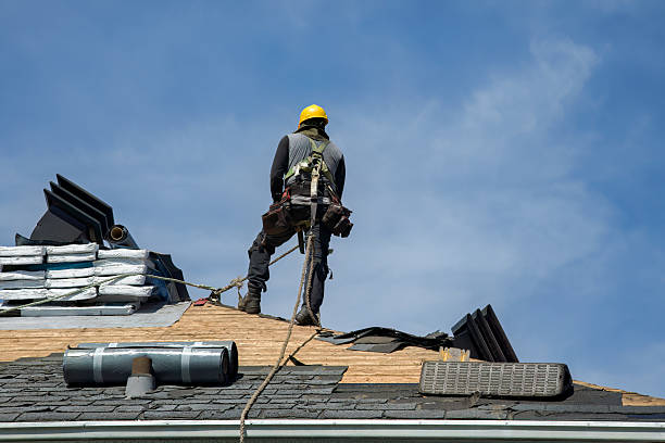 Professional Roofing technician working in Henderson, IA